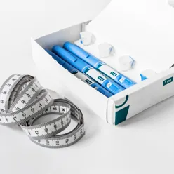 Medisiner og et målebånd