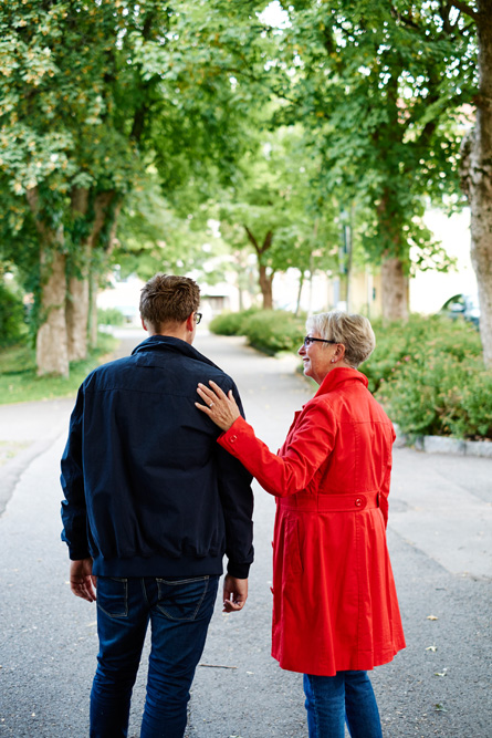 A man and woman walking on a road