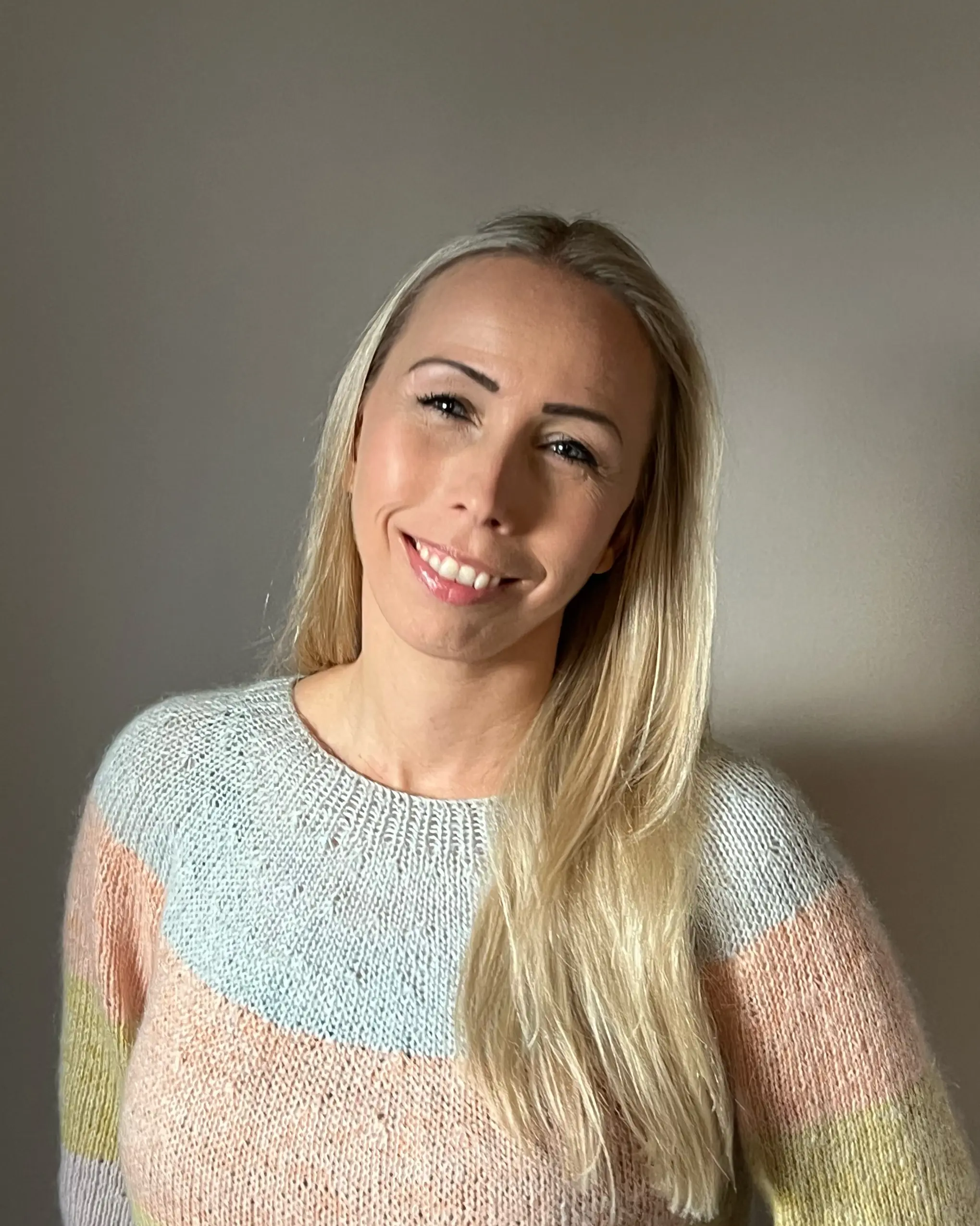 A woman smiling for the camera