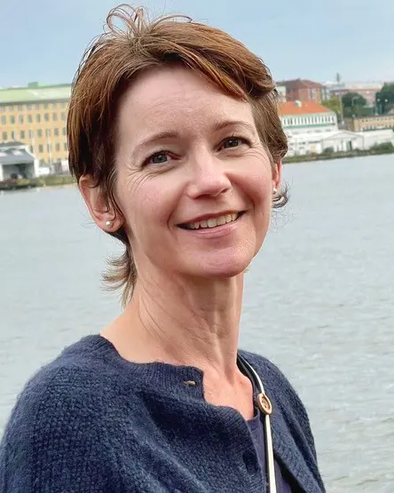 A woman smiling for the camera